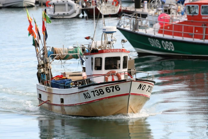 A small boat in a body of water